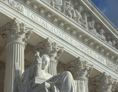 Image of a statue in front of the Supreme Court