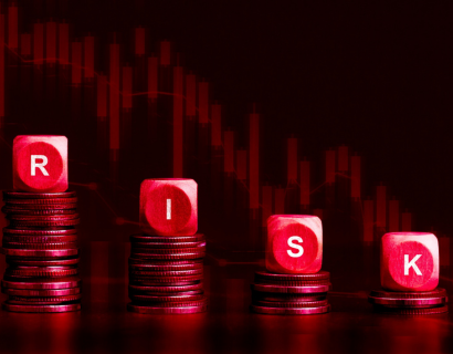 Dice on top of coins spell out 